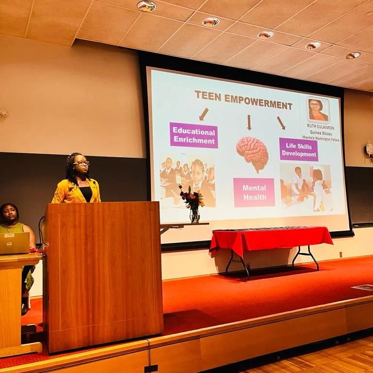 Founder presenting a teen empowerment plan at Cornell University